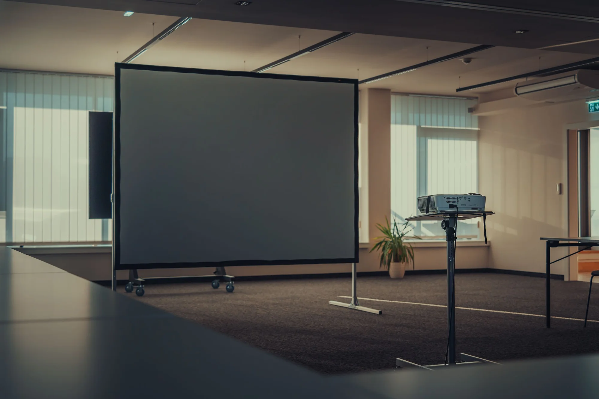 Projector and freestanding screen in a meeting room