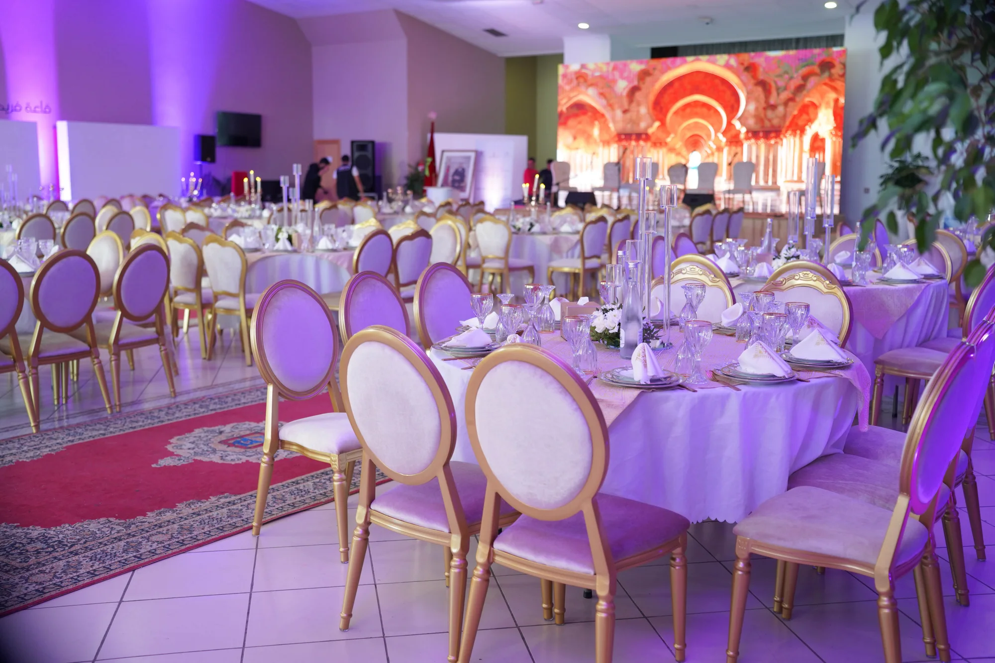 Reception room with purple uplighting