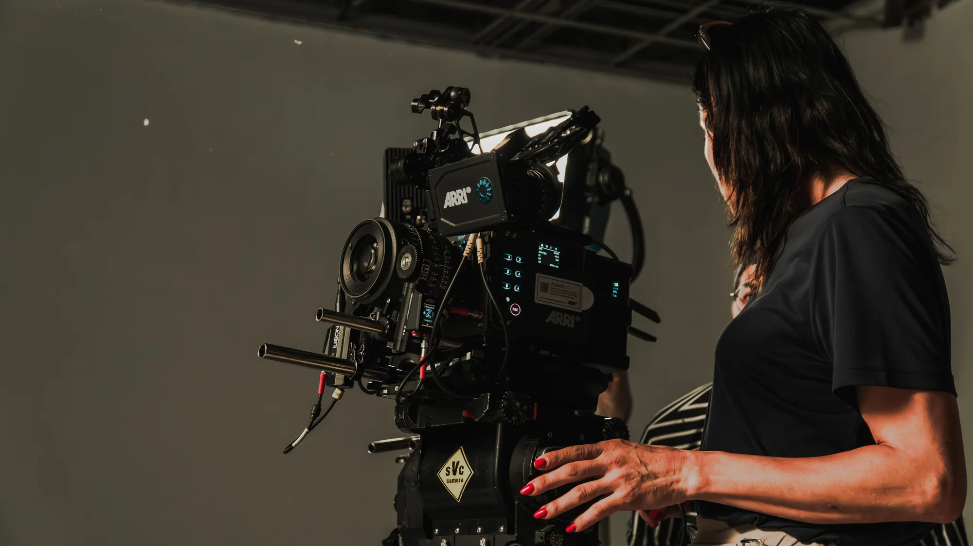 Camera operator preparing for a shoot